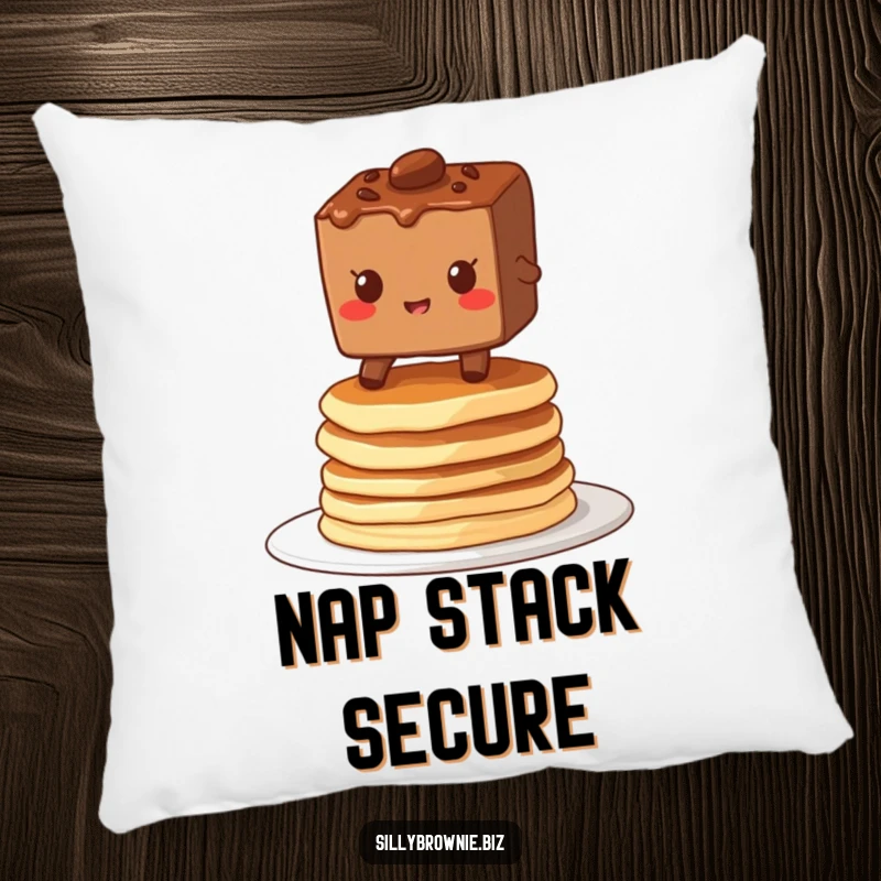Funny pillow with a brownie character grinning while balancing on a stack of wobbly pancakes, adding a touch of breakfast cheer.