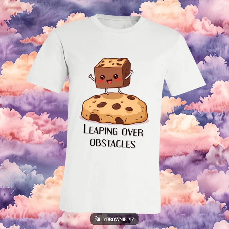 Funny t-shirt showing a square brownie with legs enthusiastically jumping over a giant cookie crumb, promoting a sense of fun.